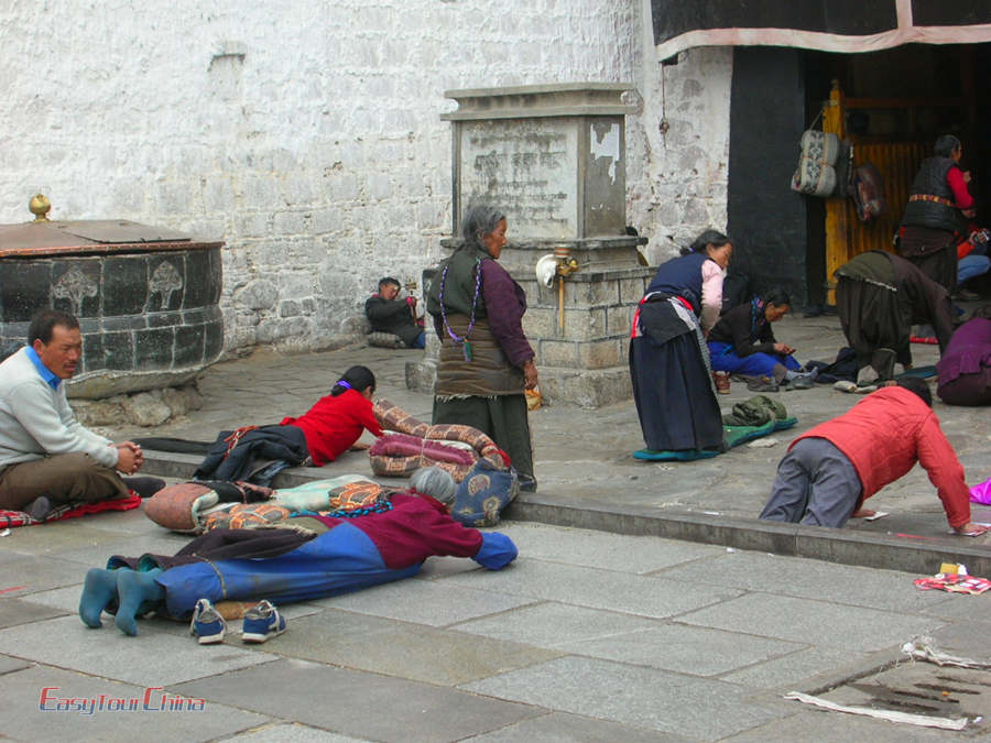 Local Tibetan people pray in front of Jokhang Temple in Lhasa